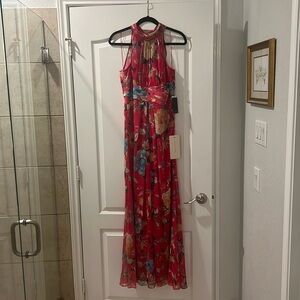 Brand new. Never been worn. Chiffon halter gown.